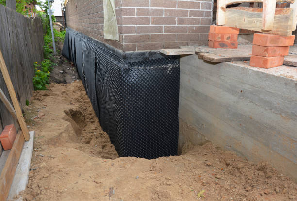 Happy homeowners after waterproofing job in South Bloomingville